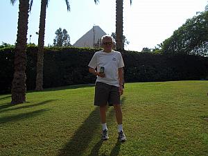 Dad Klocke posing with a Mountain Dew, showing off the Arabic logo. Pyramid in the background.