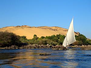 A felucca (traditional wooden Egyptian sailboat) on the Nile.