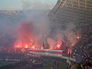 LOTS. I think in the 15 minutes after the goal, about 40 flares  were lit up. A few made their way onto the pitch. 