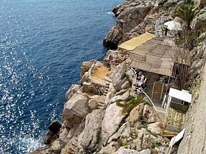 This is a cool bar nestled on the rocks on the outside of the wall, overlooking the sea. Awesome.