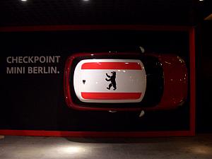 We walked by a Mini dealership on Friedrichstrasse. This was a Mini mounted on a wall.

Yes, it's near Checkpoint Charlie :)