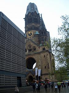 Kaiser Wilhelm Memorial Church - the church was badly damaged during the war. A new, modern church was built right next to it, and the damaged building remains standing as a reminder to the damages of war.