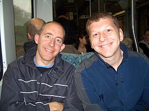 Jay and Kevin smiling on the subway.