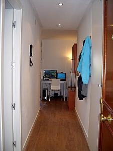 You enter our apartment into a hallway -- bathroom is on the left and a series of closets are on the right.