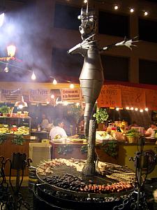 meat cooking on a cool grill for Fiesta de la San Lorenzo - Madrid's version of church festivals!