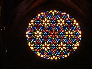 The giant rose window inside the Cathedral of Santa Maria of Palma
