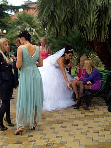 Russian wedding attire. And bride smoking a cigarette.