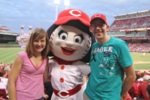 Kelly and Jay with Rosie Red at the Cincinnati Reds game during Sanger & Eby's outing. (Photo Credit: Mike Welch, mikewelch.com)
