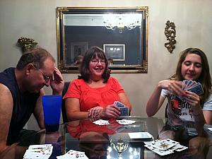 Dad, Mom and Julie playing cards --- we were playing Shanghai Rummy.