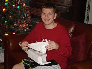 Christmas morning: Kevin opening his gift