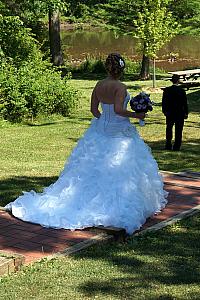 Kyleen walking to meet up with Kevin for the first time in her wedding dress