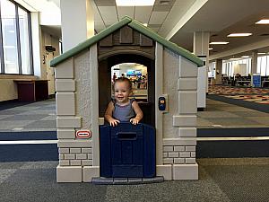 Capri enjoying the playhouse in Mobile Alabama airport