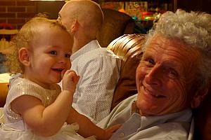 Grandpa is very excited that Capri crawled off of Jay to play with him!