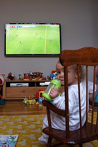 That's my girl! Capri and Dad spending a Sunday morning watching British Premier League soccer!