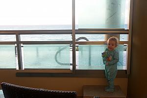 Capri on our balcony, wanting to get into the infinity pool in her PJs