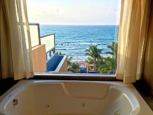 Looking out at the beach from the condo's master bathroom.