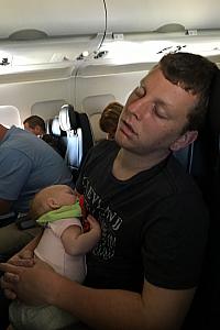 Kevin and Kenley sleeping on their flight home.