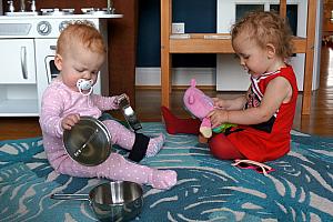 Capri and Kenley playing with the kichen toys