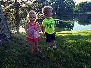 Capri and Emmett releasing a turtle we found on our driveway