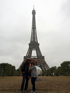 Nana and Papa and Capri in front of the Eiffel Tower - yes, it's raining. It rained on us basically the whole day1