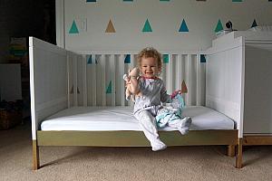 Capri modeling her new big girl bed (we took off the front of the crib).