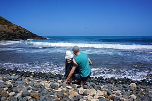 Dad and Capri checking out the rocky beach