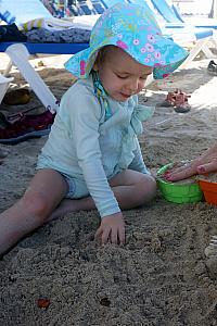 Capri enjoying some sand time.