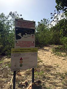 I don't often find notices about explosives at the beach! Background: Vieques island was a U.S. military base from the 1940s until early 2000s. One of its major uses was as a test bombing site. So, these signs are posted all around the perimeter of the don't-ener bombed areas. Don't worry, the beaches themselves are very safe!