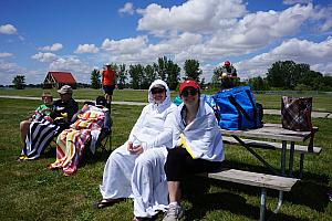 Some of the adults all bundled up in their beach towels :). It was in the 60s and very windy this day (we had summer weather a couple days later)
