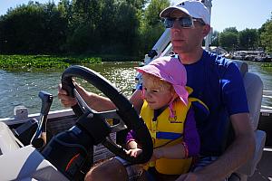 Capri and Dad driving the boat