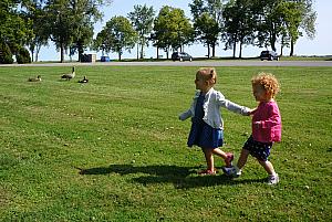 Capri and Kenley running to see the geese